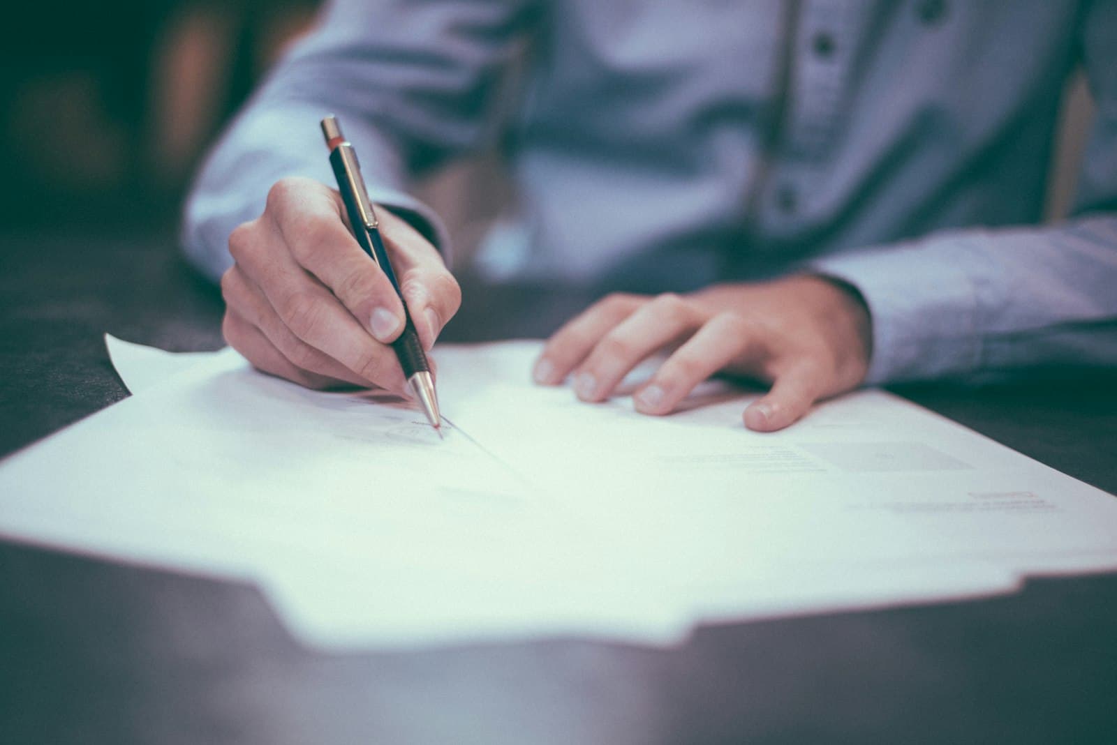 Reviewing paperwork at a desk